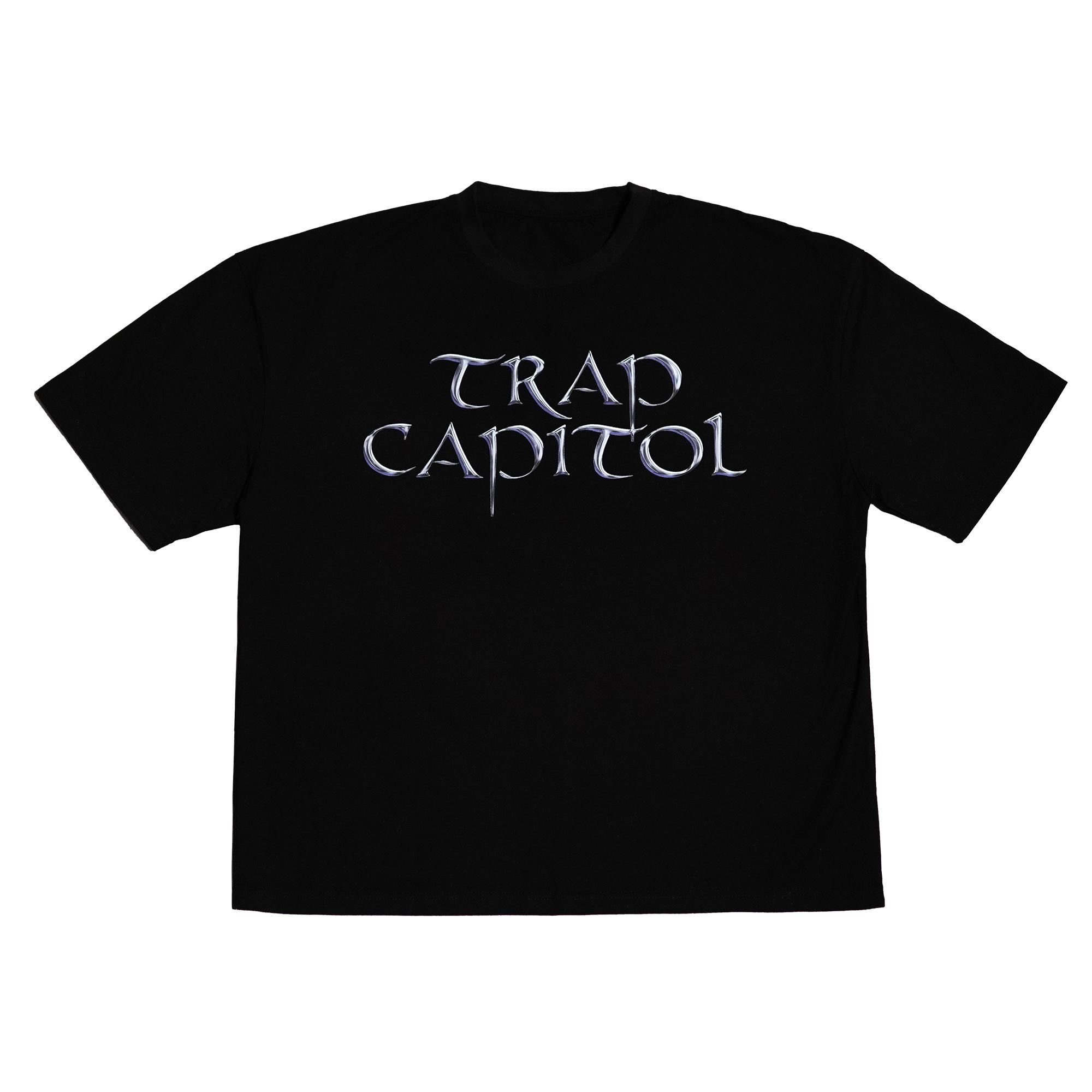 Flat lay image of a black t-shirt featuring the metallic 'TRAP CAPITOL' graphic printed across the front